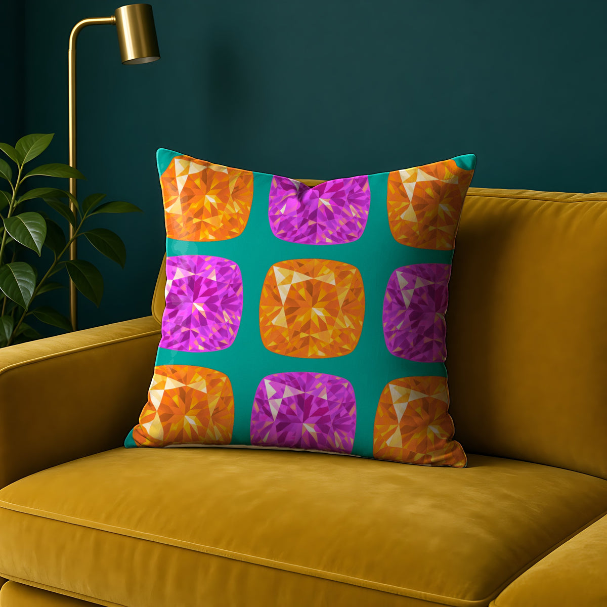 Giant Cut Gem Grid Faux Suede Cushion in the Peacock Jewel palette, on a mustard sofa against a teal wall