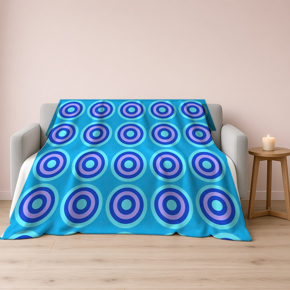 Mega Ring Grid Sherpa Fleece Blanket draped over a grey sofa