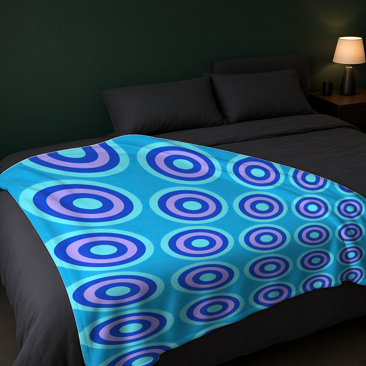 Mega Ring Grid Sherpa Fleece Blanket across the foot of a dark bed