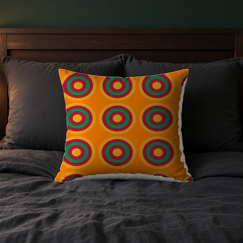 Mega Ring Grid Faux Suede Cushion on a bed with charcoal bedding