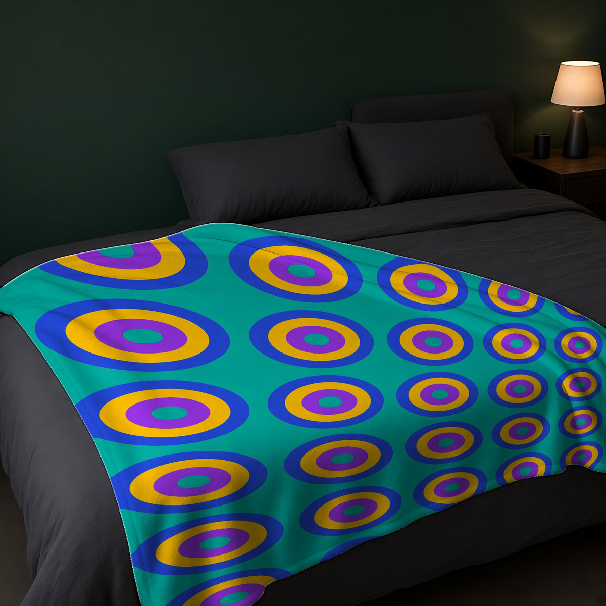 Giant Op-Art Jewel Rings Sherpa Fleece Blanket across the foot of a dark bed