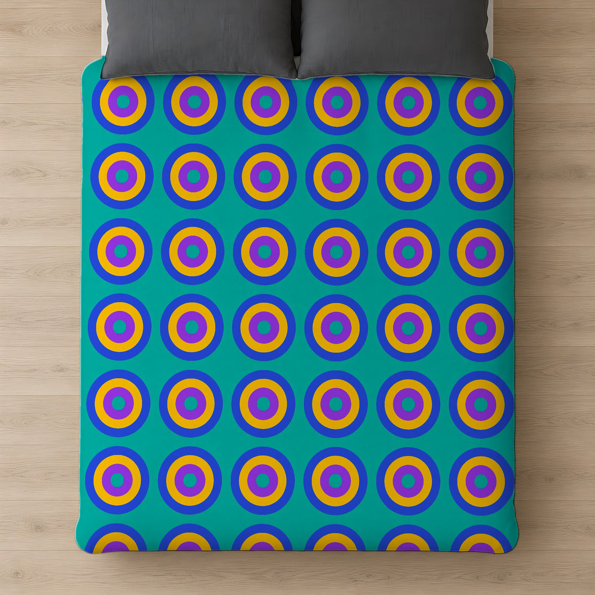 Giant Op-Art Jewel Rings Comforter on a bed, seen from above