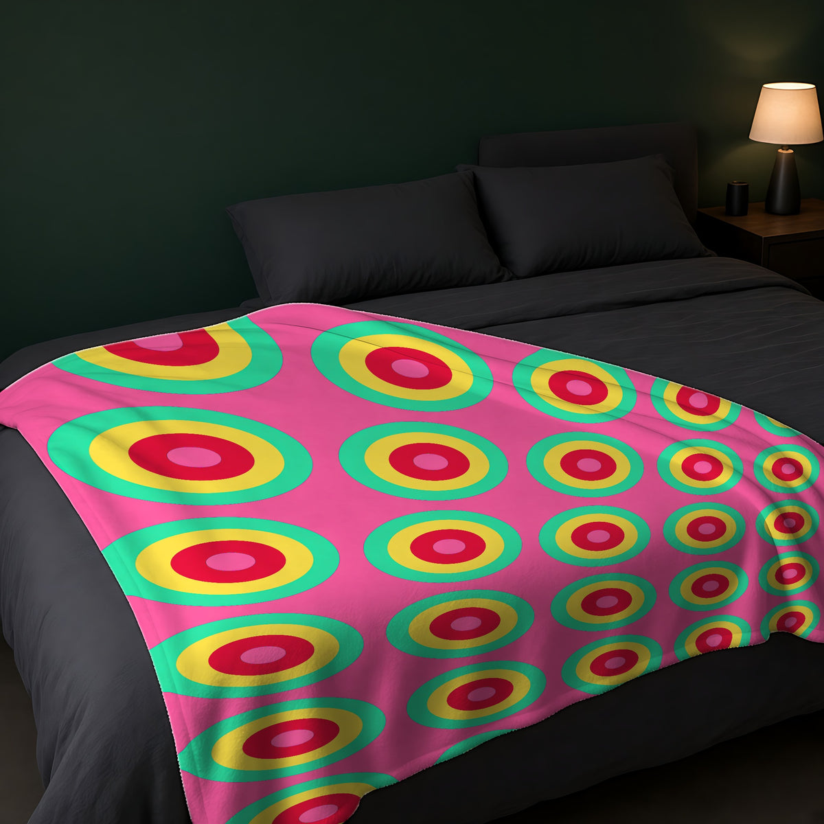 Giant Op-Art Jewel Rings Sherpa Fleece Blanket across the foot of a dark bed