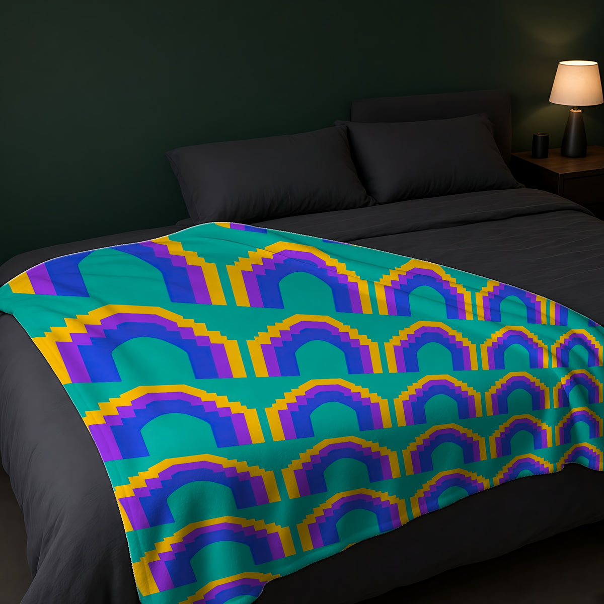 Grand Stepped Arches Sherpa Fleece Blanket across the foot of a dark bed