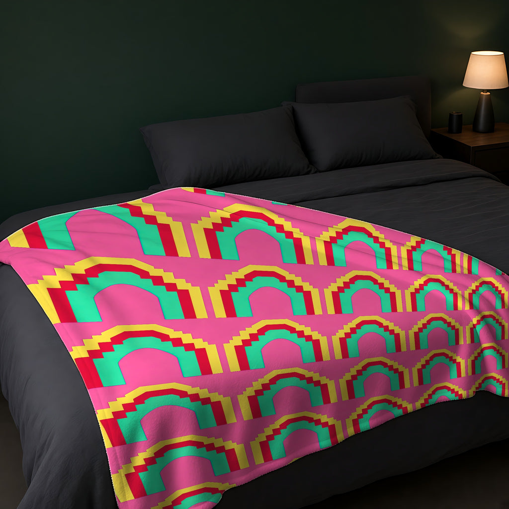 Grand Stepped Arches Sherpa Fleece Blanket across the foot of a dark bed