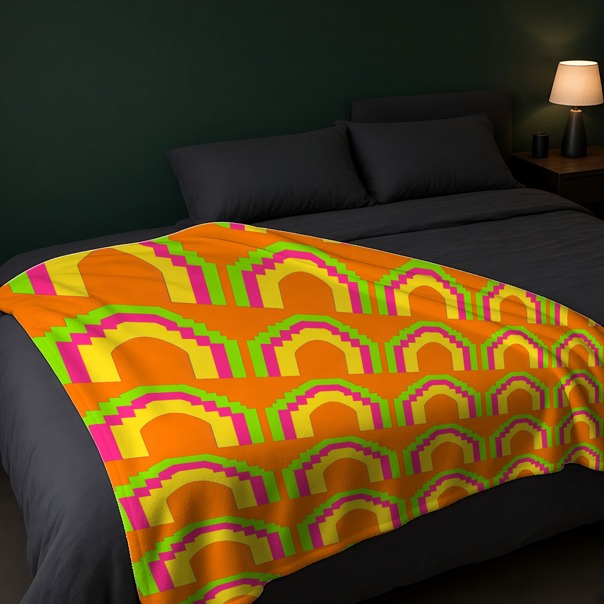 Grand Stepped Arches Sherpa Fleece Blanket across the foot of a dark bed