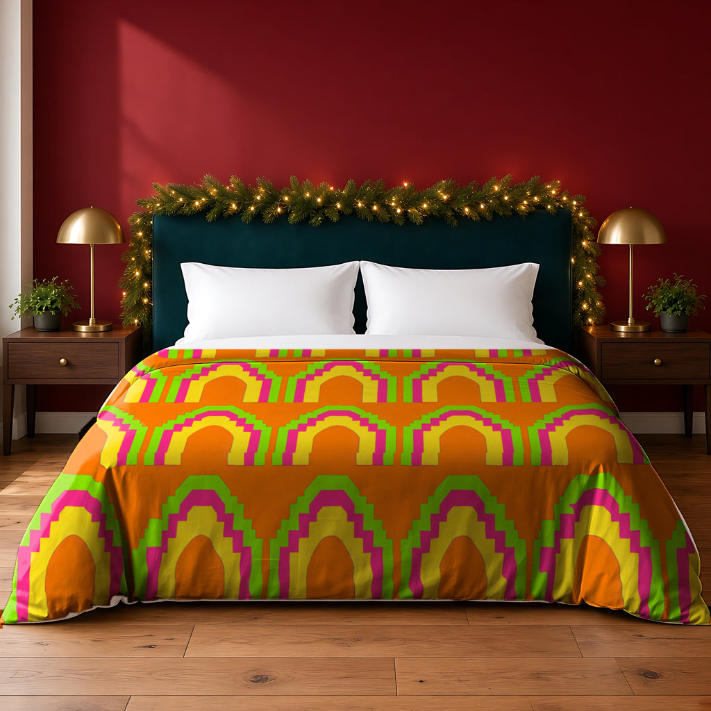 Grand Stepped Arches Cotton Duvet Cover in the Hot Citrus Festive palette, on a bed with a green headboard in a festive bedroom with pine garland and fairy lights
