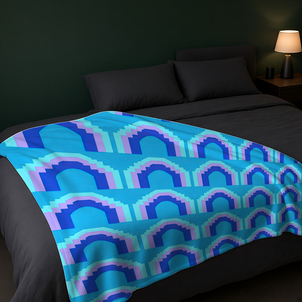 Grand Stepped Arches Sherpa Fleece Blanket across the foot of a dark bed