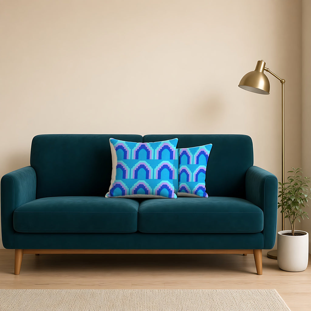 Grand Stepped Arches Faux Suede Cushion on a teal velvet sofa