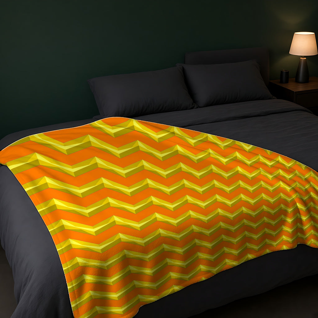 Broad Cut-Gem Chevrons Sherpa Fleece Blanket across the foot of a dark bed