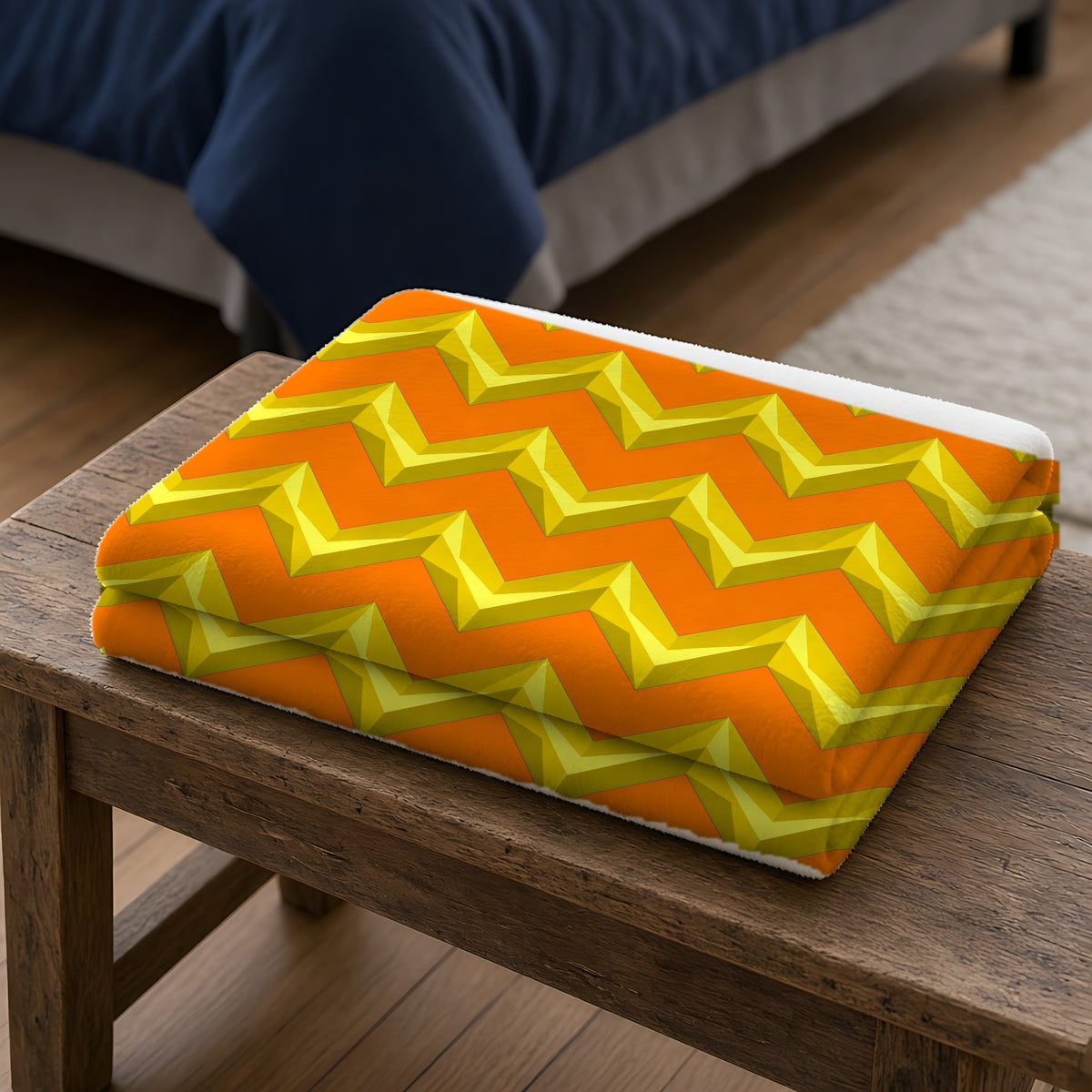 Broad Cut-Gem Chevrons Sherpa Fleece Blanket folded on a wooden bench