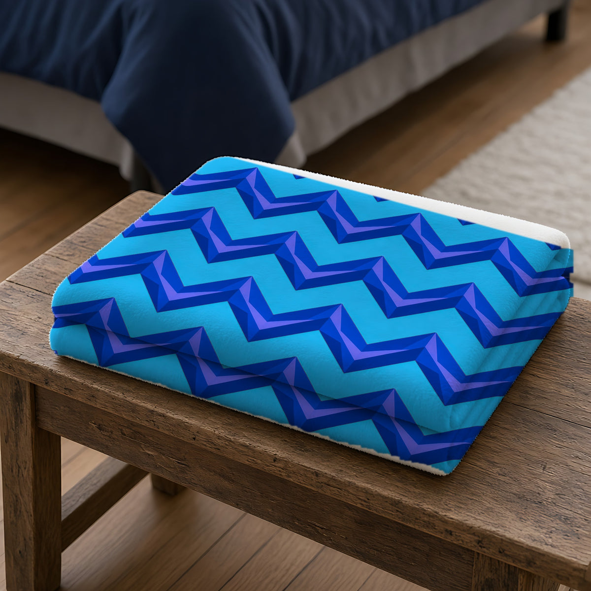 Broad Cut-Gem Chevrons Sherpa Fleece Blanket folded on a wooden bench