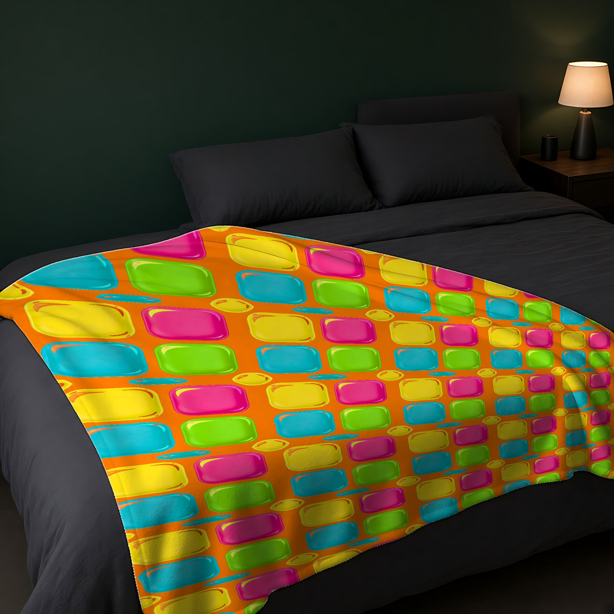 Giant Puffy Glass Cushions Sherpa Fleece Blanket across the foot of a dark bed