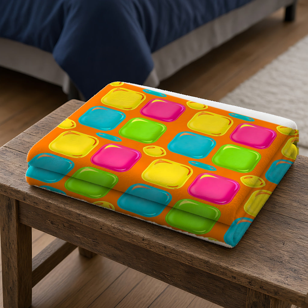 Giant Puffy Glass Cushions Sherpa Fleece Blanket folded on a wooden bench