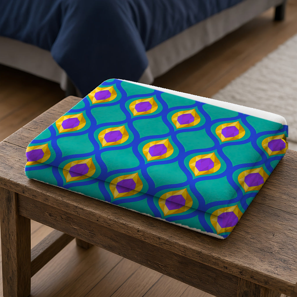 Grand Gold Ogee Lattice II Sherpa Fleece Blanket folded on a wooden bench