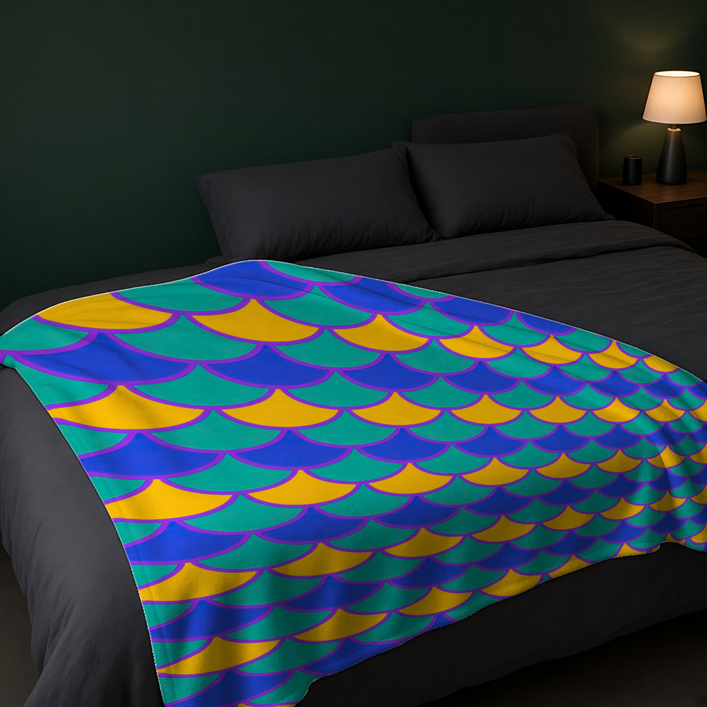 Big Jewel Scales II Sherpa Fleece Blanket across the foot of a dark bed