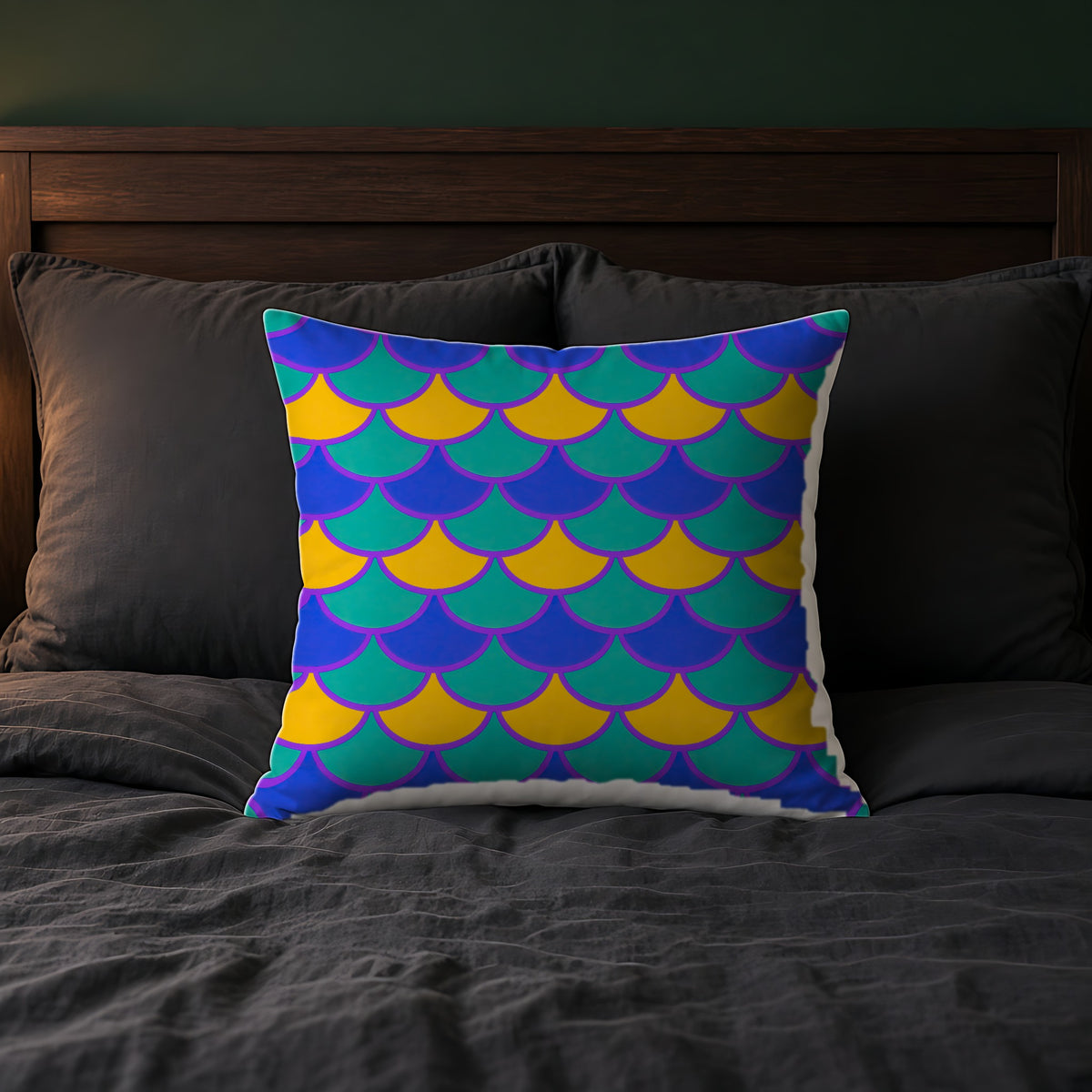 Big Jewel Scales II Faux Suede Cushion on a bed with charcoal bedding