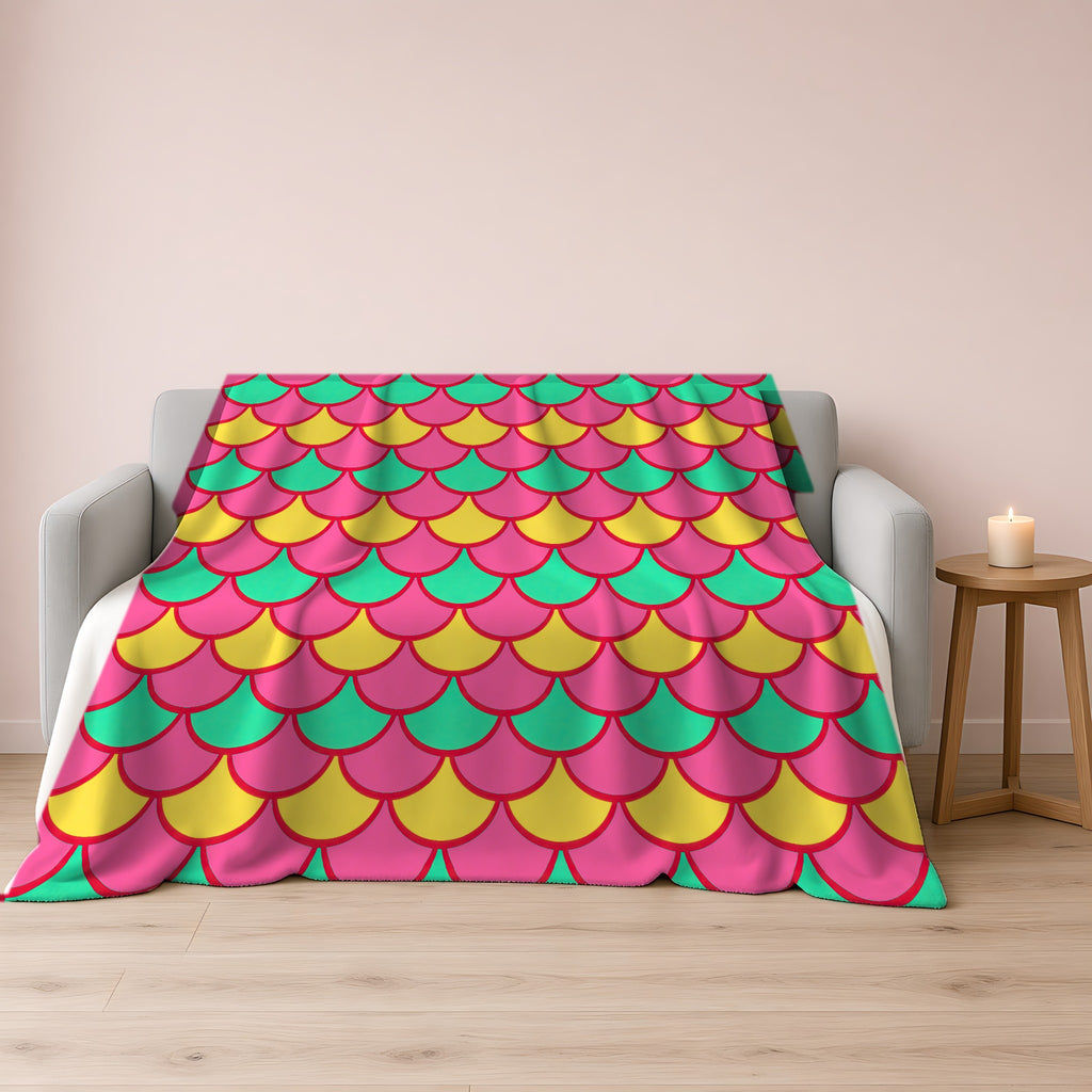 Big Jewel Scales II Sherpa Fleece Blanket draped over a grey sofa