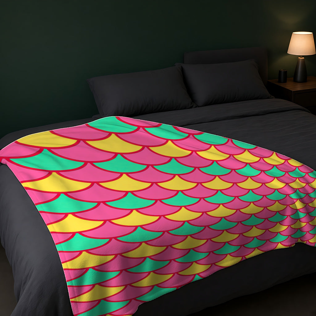 Big Jewel Scales II Sherpa Fleece Blanket across the foot of a dark bed