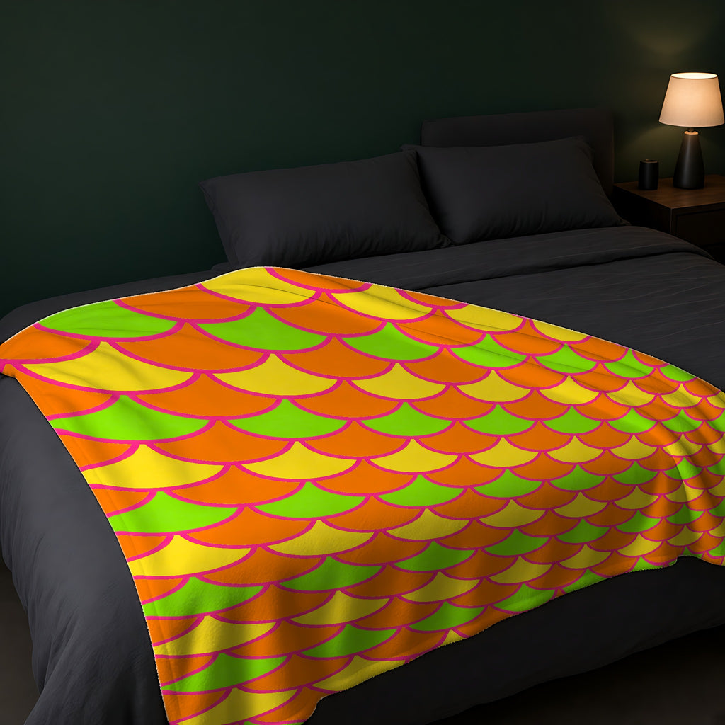 Big Jewel Scales II Sherpa Fleece Blanket across the foot of a dark bed
