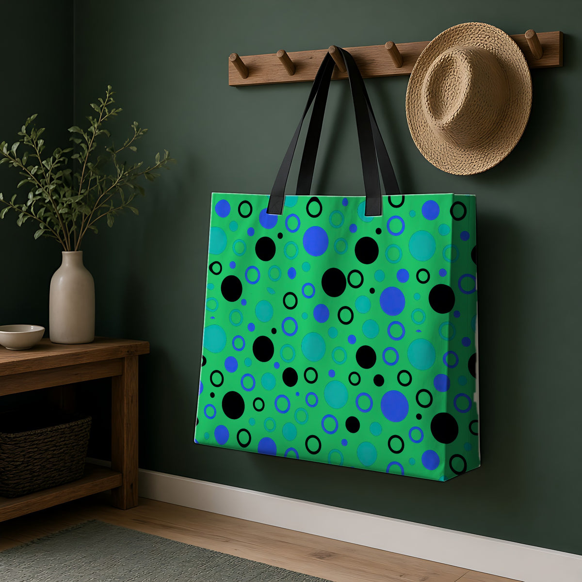 Bubble Outlines Weekender Tote Bag hanging on a peg rail in a green hallway