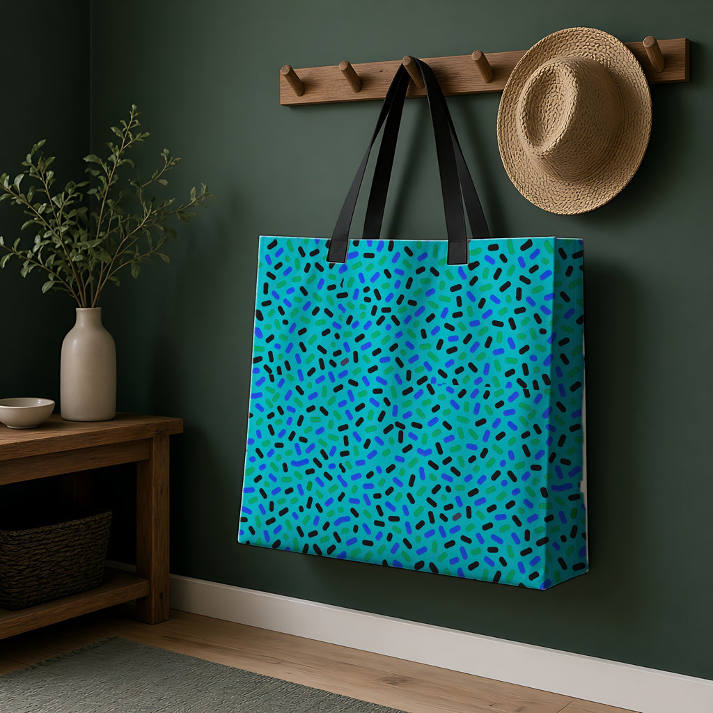 Sprinkle Pop Weekender Tote Bag hanging on a peg rail in a green hallway