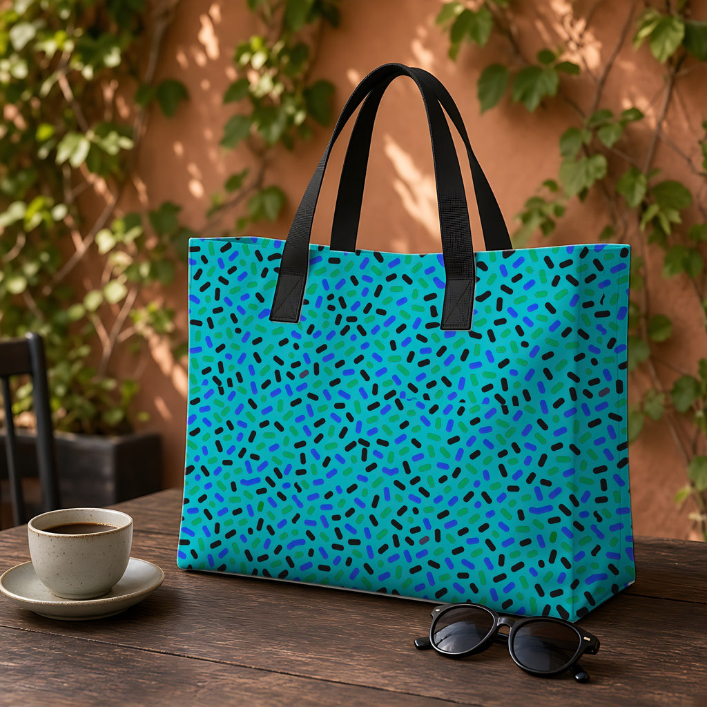 Sprinkle Pop Weekender Tote Bag on a garden café table