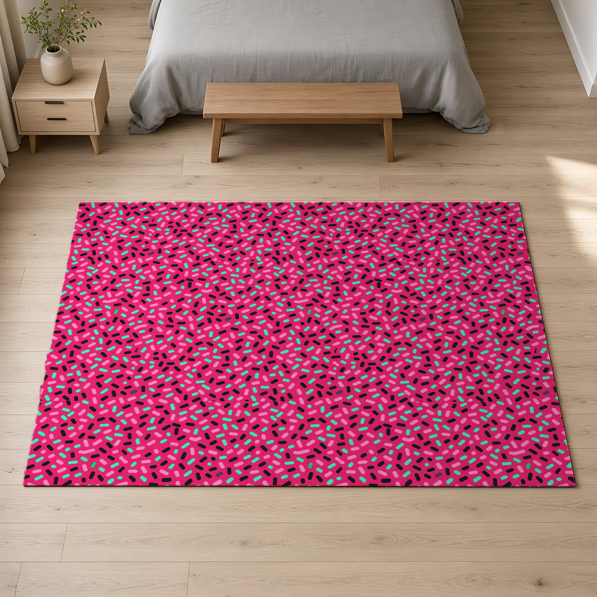 Sprinkle Pop Outdoor Rug on a pale oak floor in a calm bedroom