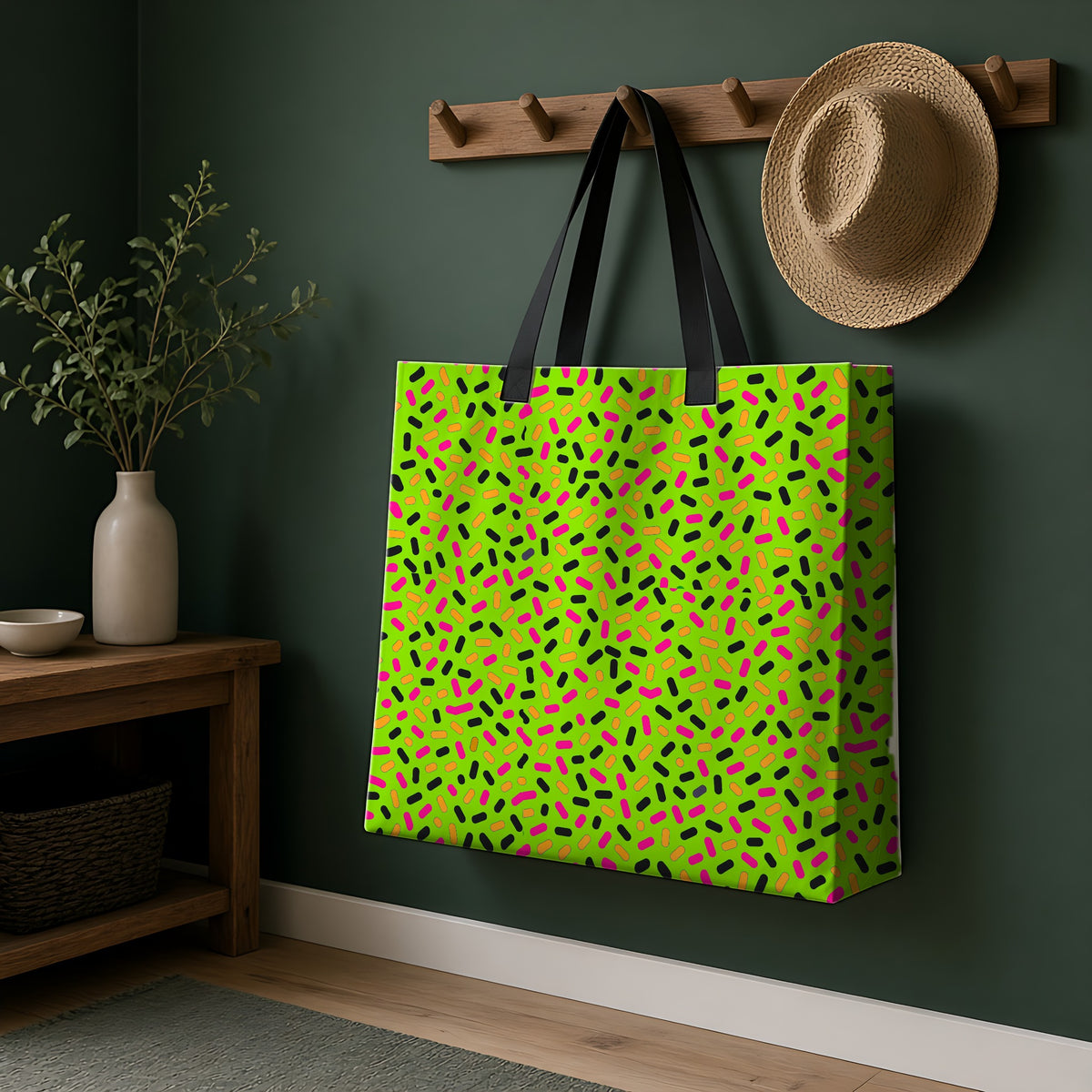 Sprinkle Pop Weekender Tote Bag hanging on a peg rail in a green hallway