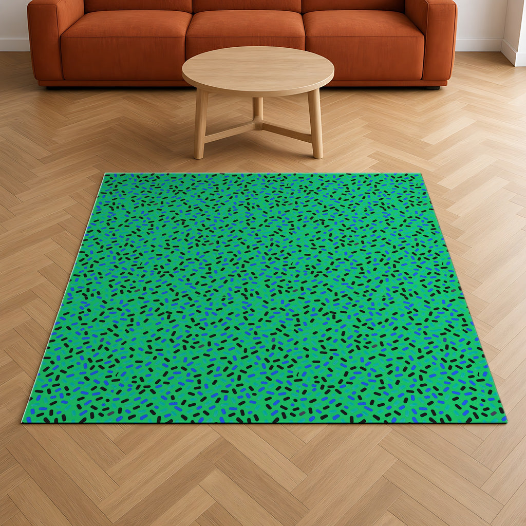 Sprinkle Pop Outdoor Rug on a herringbone wood floor in a living room