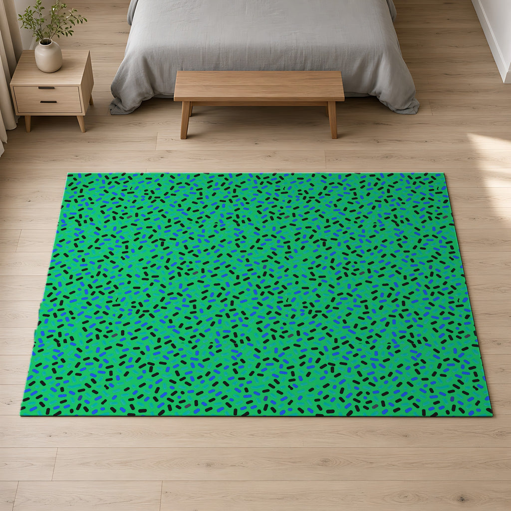 Sprinkle Pop Outdoor Rug on a pale oak floor in a calm bedroom