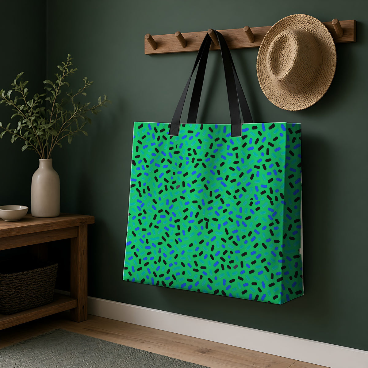 Sprinkle Pop Weekender Tote Bag hanging on a peg rail in a green hallway
