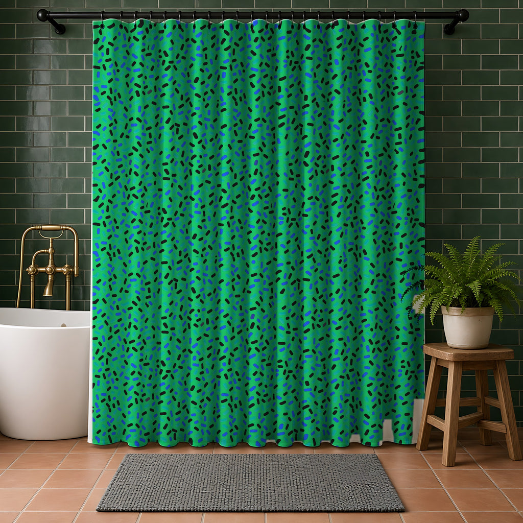 Sprinkle Pop Shower Curtain in a bathroom with dark green tiles
