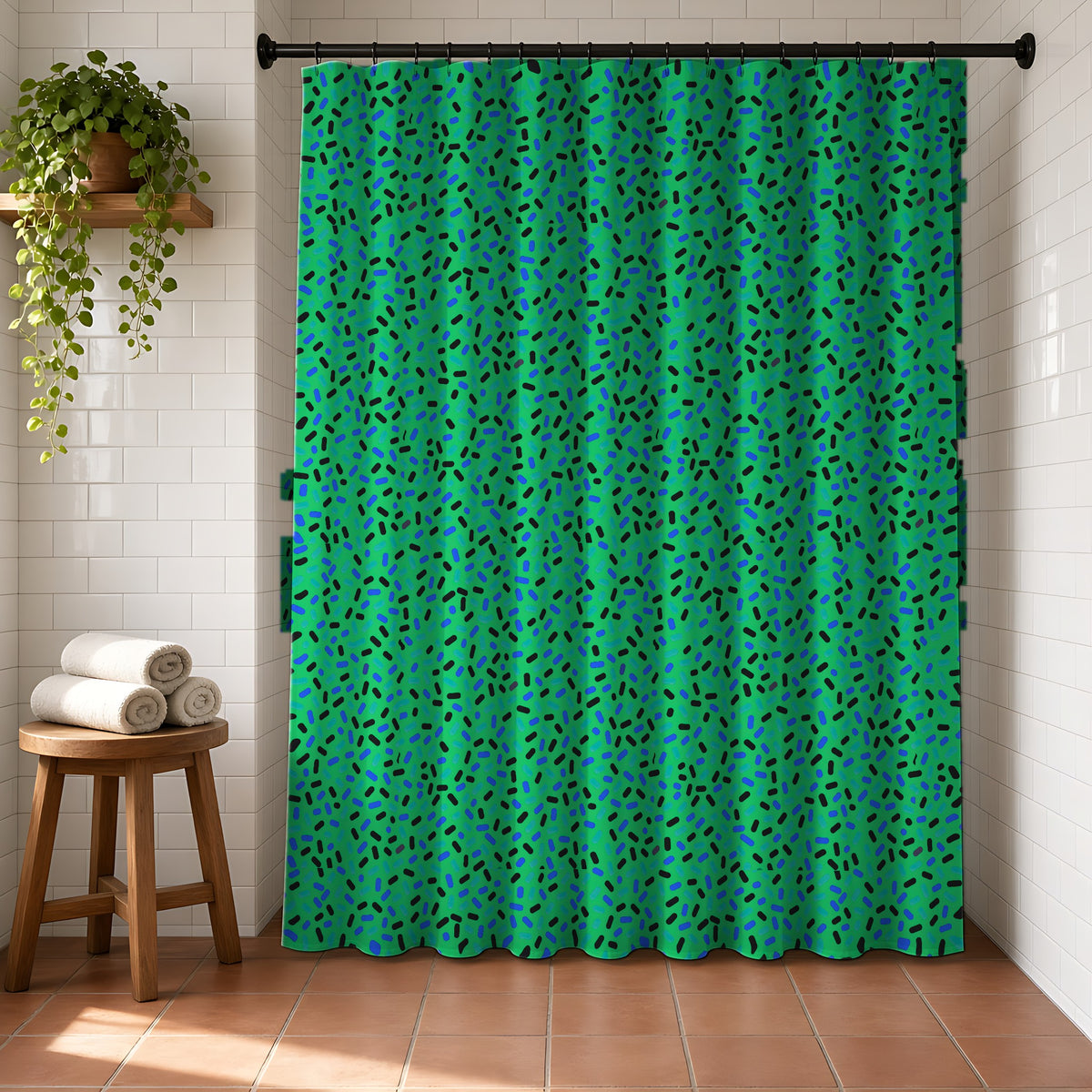 Sprinkle Pop Shower Curtain in a bright bathroom with white tiles and a terracotta floor