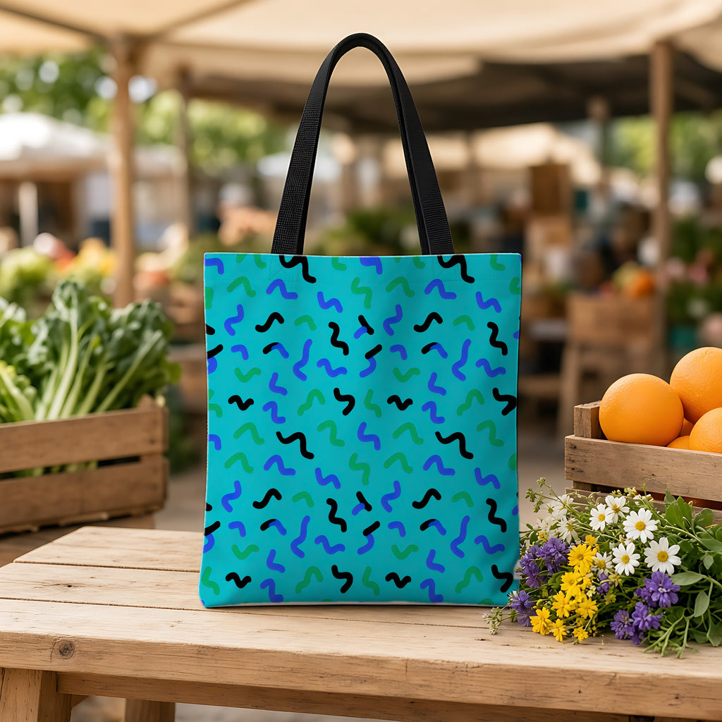 Squiggle Strokes Weekender Tote Bag on a wooden bench at a farmers market