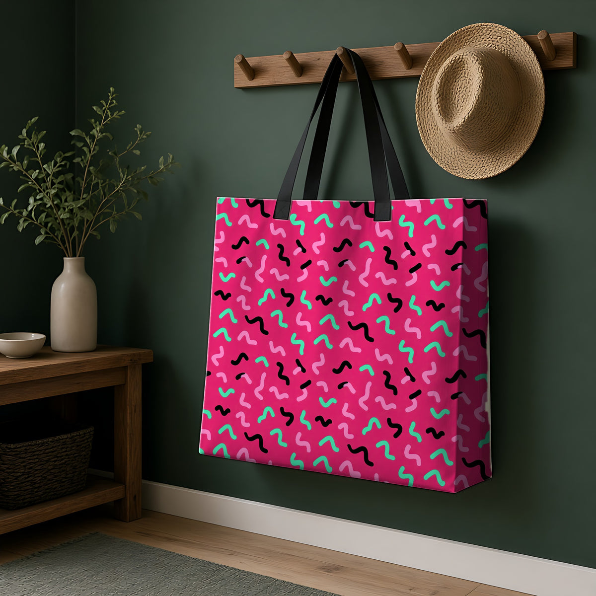 Squiggle Strokes Weekender Tote Bag hanging on a peg rail in a green hallway