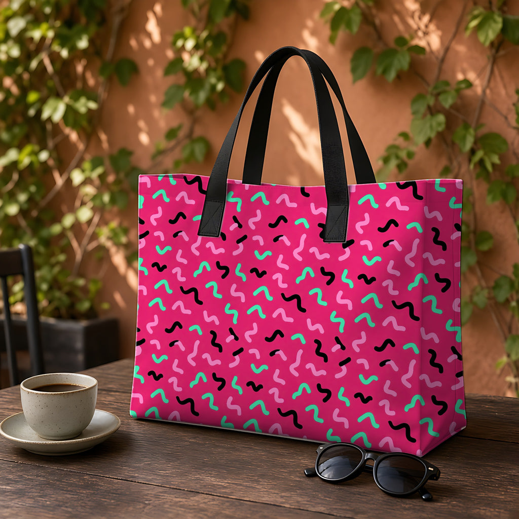 Squiggle Strokes Weekender Tote Bag on a garden café table