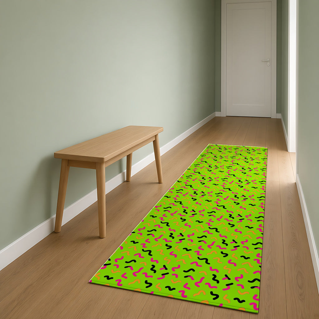 Squiggle Strokes Outdoor Rug as a runner in a sage-green hallway