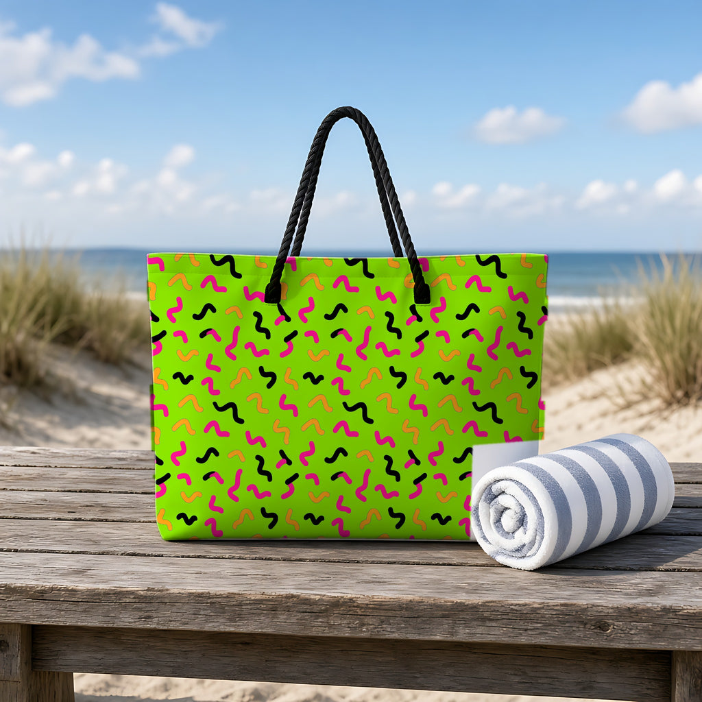 Squiggle Strokes Weekender Tote Bag on a rustic table by the beach