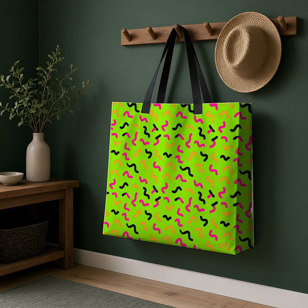 Squiggle Strokes Weekender Tote Bag hanging on a peg rail in a green hallway