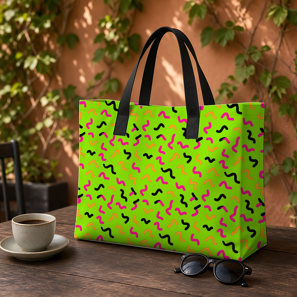 Squiggle Strokes Weekender Tote Bag on a garden café table