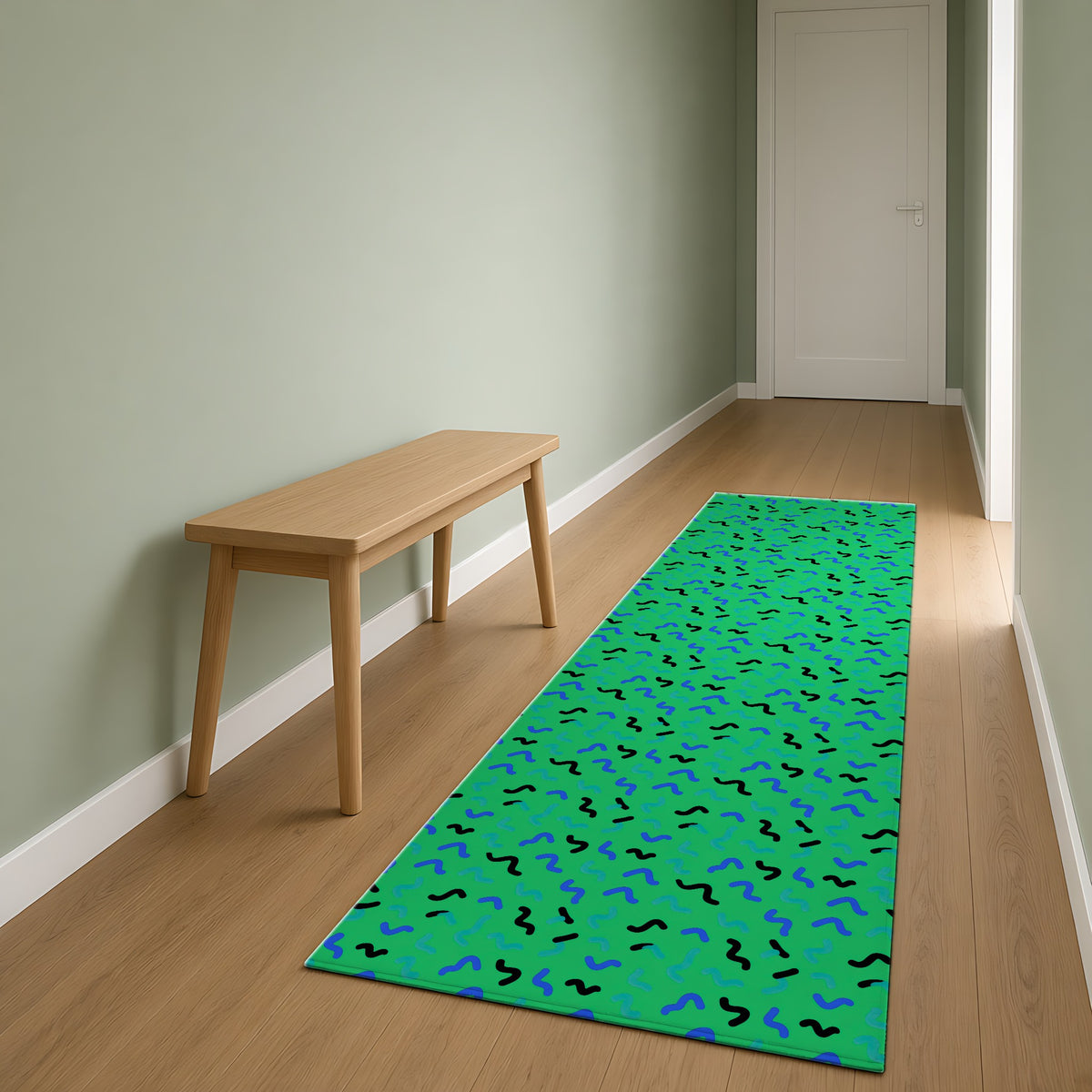 Squiggle Strokes Outdoor Rug as a runner in a sage-green hallway