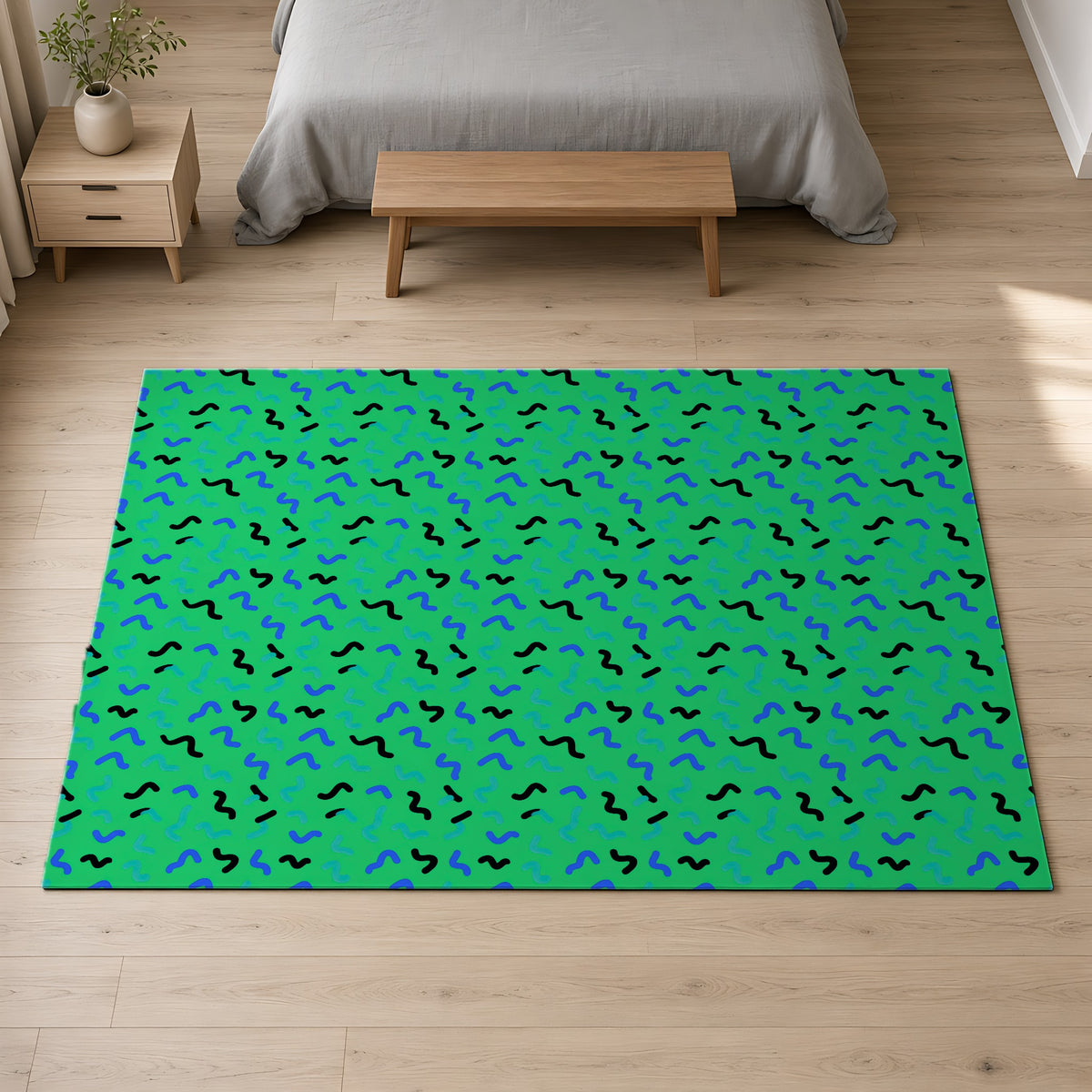 Squiggle Strokes Outdoor Rug on a pale oak floor in a calm bedroom