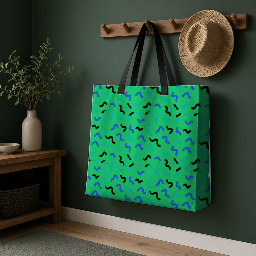 Squiggle Strokes Weekender Tote Bag hanging on a peg rail in a green hallway