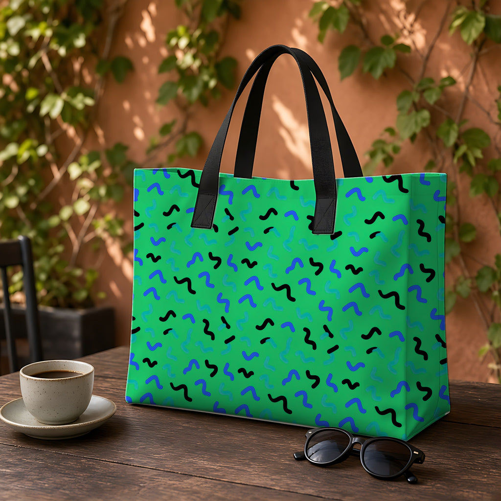 Squiggle Strokes Weekender Tote Bag on a garden café table