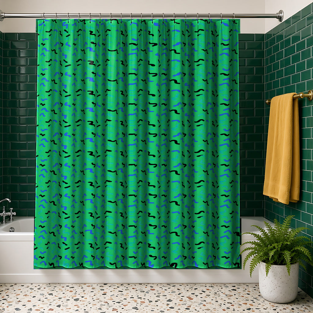 Squiggle Strokes Shower Curtain in the Ocean Jewel palette, hanging in a bathroom with emerald tiles