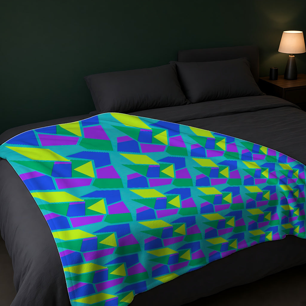 Cubist Block Quilt Sherpa Fleece Blanket across the foot of a dark bed