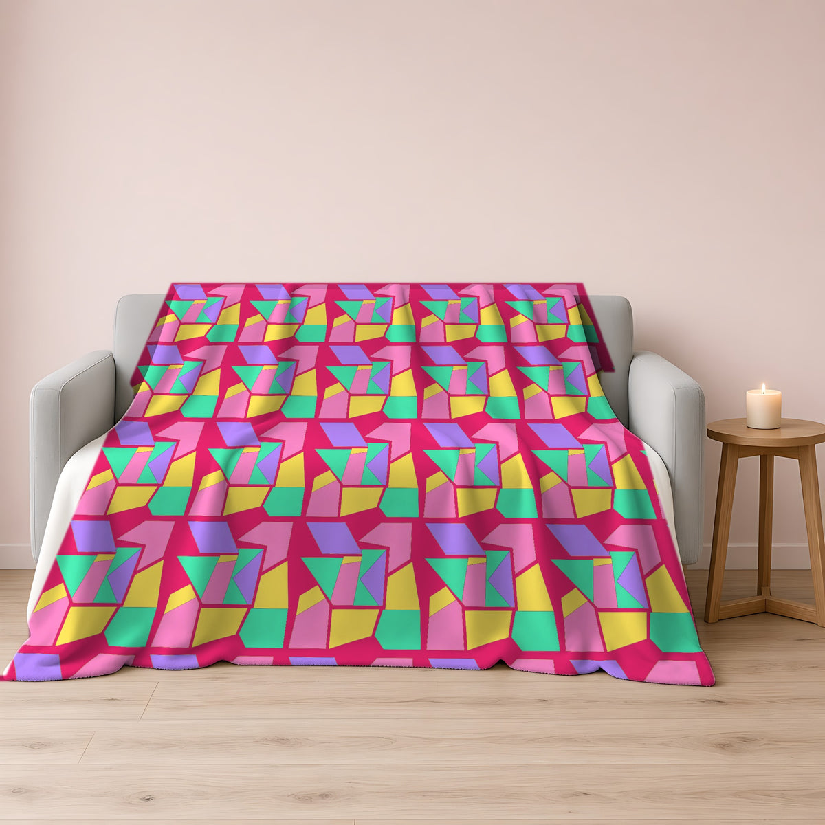 Cubist Block Quilt Sherpa Fleece Blanket draped over a grey sofa