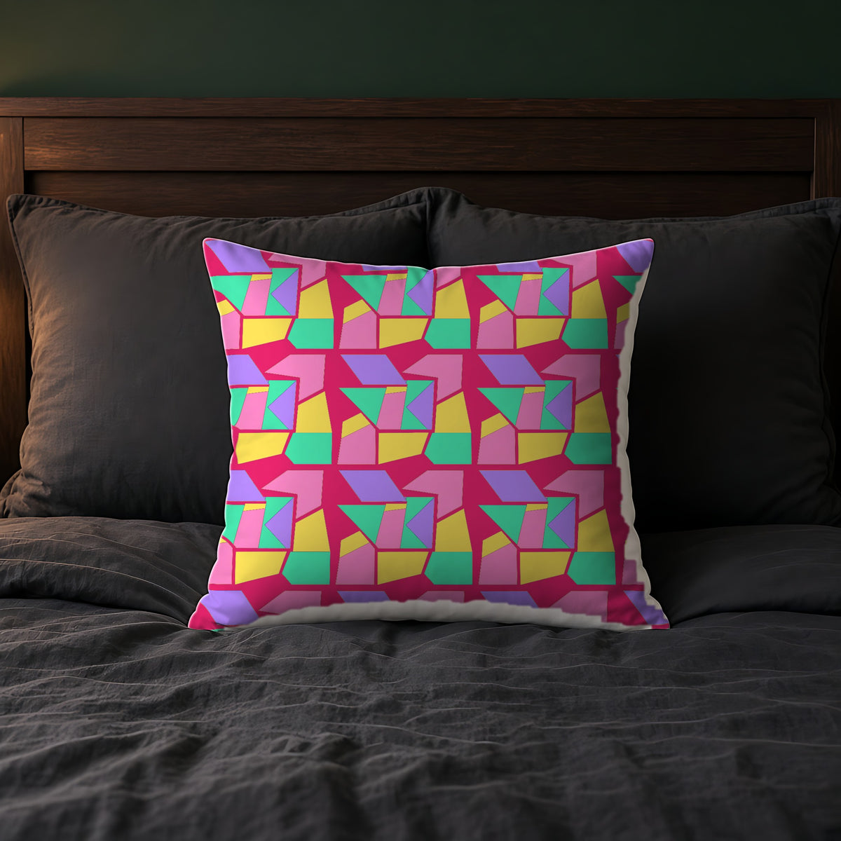 Cubist Block Quilt Faux Suede Cushion on a bed with charcoal bedding