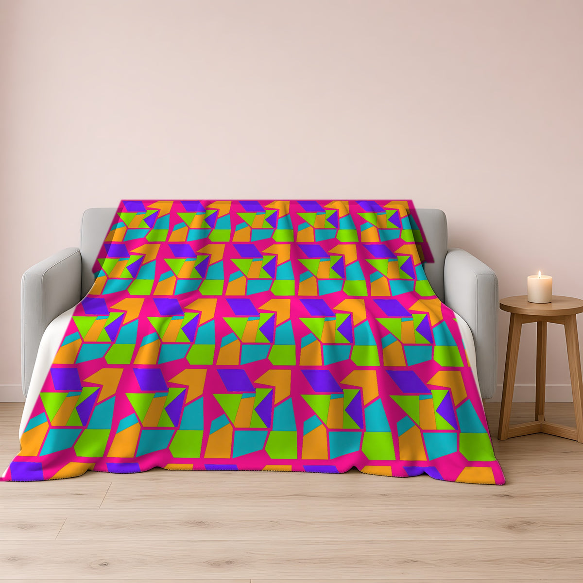 Cubist Block Quilt Sherpa Fleece Blanket draped over a grey sofa